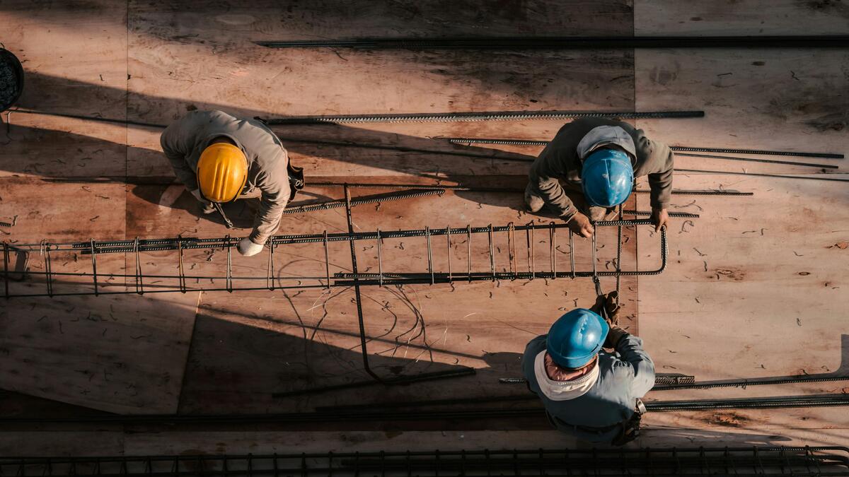 Skilled rebar workers installing steel reinforcement