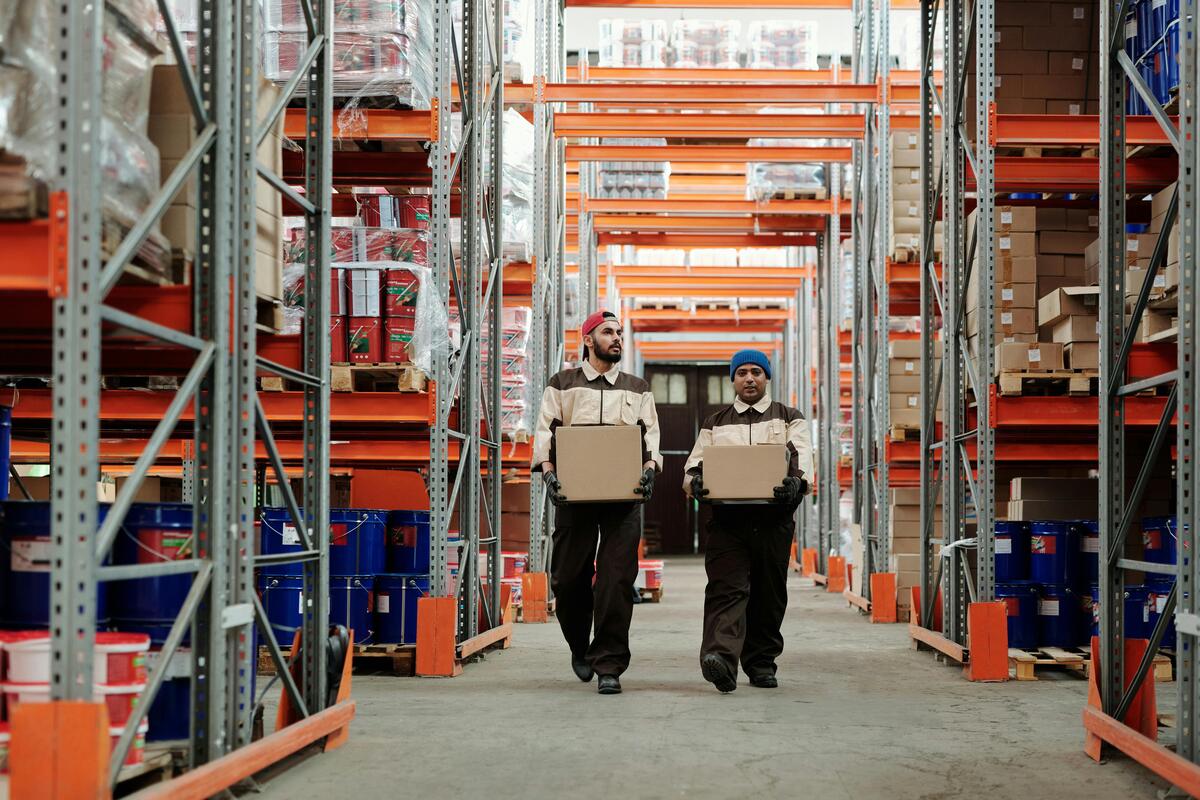 Professional warehouse workers in modern distribution center