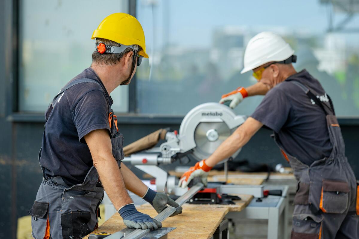 Professional certified welders working on construction site
